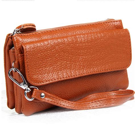 clutch wallet with shoulder strap.